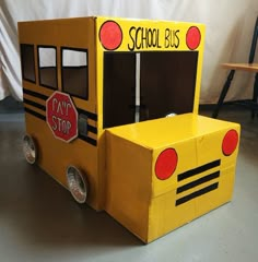 a cardboard school bus made to look like it is parked