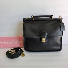 Vtg Coach Original Willis Satchel Classic style and built to last!Black leather with brass hardware.Top handle Features: 1 roomy areas, inner zip pocket, outer slip pocket covered by a flap and secured with a turnlock-large back slip pocket-Adjustable, detachable 42" StrapMeasures: 10 1/2"L, 10"H, 3"WMade in the United States#1644-322Cleaned, conditioned and ready to wear!Questions? Just AskMore vtg coach colors/styles availableG129 Classic Everyday Satchel With Brass Hardware, Classic Business Satchel With Turn-lock Closure, Black Satchel With Brass Hardware For Work, Classic Flap Briefcase With Leather Lining, Classic Everyday Briefcase With Brass Hardware, Classic Shoulder Bag With Brass Hardware, Leather Satchel With Cc Turnlock For Office, Classic Briefcase With Brass Hardware For Everyday, Vintage Formal Shoulder Bag For Fall