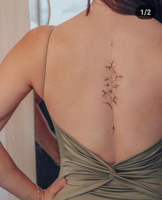 a woman with a tattoo on her back