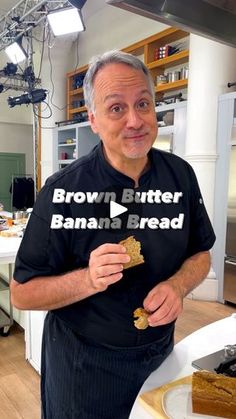 a man holding a piece of bread in front of his face with the words brown butter banana bread on it