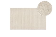 a white rug with a circle on top