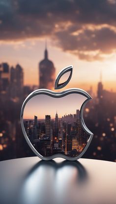 an apple logo on top of a table in front of a cityscape