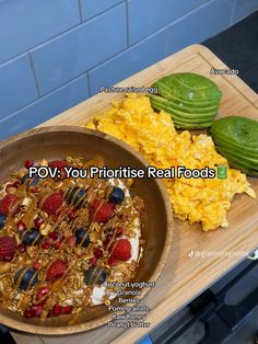 there is a bowl of oatmeal and fruit on the table