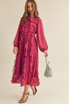 Make a statement in this stunning Ruffle Trim Midi Dress in Magenta Berry. The dress features long puff sleeves with elastic cuffs and a round neckline, making it perfect for any occasion. The cinched waist with an elastic back creates a flattering silhouette, while the midi skirt with ruffle trim detail adds a touch of elegance. The dress is fully lined, ensuring maximum comfort, and the keyhole back with tying detail adds a chic finishing touch. Dress it up with heels or keep it casual with sa Holiday Midi Dress, Midi Long Sleeve Dress, Apostolic Outfit, Gold Clothing, Classy Clothing, 2024 Dresses, Ruffle Neck Dress, Puff Sleeve Midi Dress, Apostolic Fashion