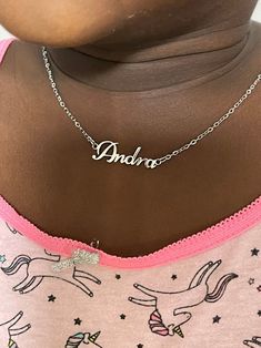 This necklace features a Dainty Sterling Silver Personalized Name Necklace with Chain. You can have your own name or word made. All carving will be made in the font as the photo. This necklace and chain are dainty #namenecklace #childrenday #childrensday #giftforkids #silvernecklace Custom Name Pendant Necklace With Adjustable Fit, Silver Custom Name Necklace For Birthday Gift, Silver Custom Name Necklace For Birthday, Personalized White Pendant Name Necklace, Silver Name Necklace For Birthday Gift, Silver Nameplate Charm Necklaces As Birthday Gift, Silver Nameplate Charm Necklace For Birthday Gift, Adjustable Silver Necklace With Custom Name, Customized Adjustable Sterling Silver Name Necklace