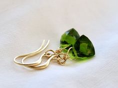 This listing is for a pair of earrings made with beautifully faceted peridot stones, and hung on  your choice of ear wires in the drop down menu on the right.  Stones - 8x10mm Length of earrings from top of ear wire - 1 1/4  Arrives beautifully gift wrapped Peridot Earrings In Lime Green As A Gift, Faceted May Birthstone Earrings Gift, Peridot Earrings For May Birthstone Gift, Peridot Lime Green Earrings As Gift, Peridot Lime Green Earrings For Gift, Green Briolette Earrings For Gifts, Lime Green Peridot Earrings As Gift, Peridot Earrings As A Gift, Peridot Earrings