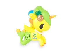 a toy that is sitting on top of a white surface and has a pineapple on it's head