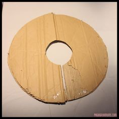 the cardboard circle is cut in half and ready to be used as an art project