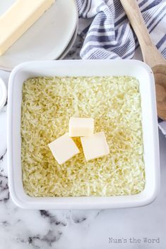 some cheese is sitting in a white bowl