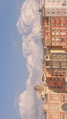 the building has many windows and balconies on it's sides as well as some clouds in the sky