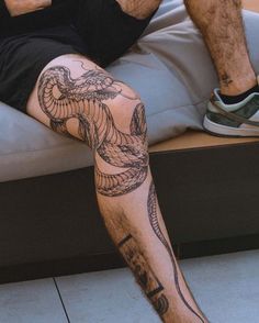 a man with a tattoo on his leg