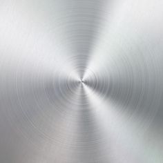 an abstract metal background with a circular design