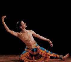 a man is dancing on the floor in an artistic pose