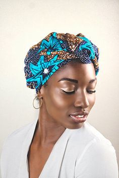 Ngozi, is our luxurious Ready-Made turquoise with accents of sandy brown and dark blue turban. You do not need to tie this turban, you simply put it on as a hat and you are good to go.  Ngozi, is a convenient turban for the busy woman.    The Ngozi ready-made turban comes; partially satin lined or non satin lined. Blue Turban Headband For Summer, Blue Headband Turban For Summer, Adjustable Blue Headwrap, Adjustable Brown Bohemian Turban, Blue Headwrap For The Beach, Bohemian Blue Headwrap For Summer, Blue Beach Headwrap Headband, Blue One-size Headwrap For The Beach, Blue One Size Headwrap For Beach