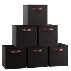 six black storage bins with leather handles on each one side and two brown handles on the other