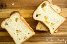 two pieces of bread with holes cut in half