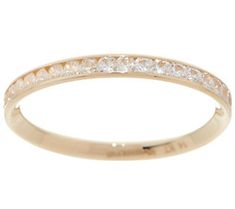 a yellow gold wedding band with white diamonds