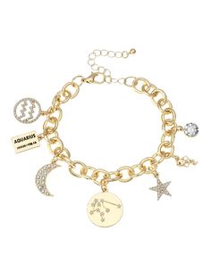 a gold charm bracelet with charms and stars on the link, including an anchor, starfish