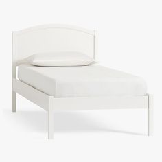 a bed with white sheets and pillows on it's headboard, against a white background