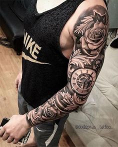 a man with tattoos on his arm