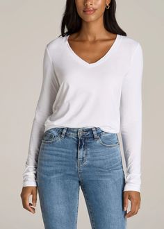 American Tall Long Sleeve Scoop V-Neck Tee. This women's tall long sleeve shirt is a timeless tee with a scooped v-neck. Basic Stretch Tops For Everyday, Casual Stretch V-neck Top For Everyday, White Long Sleeve Shirt Outfit, Long Sleeve Shirt Outfits, White Long Sleeve Tshirt, Jeans For Tall Women, Women In White, Plain White Shirt, White Long Sleeve Blouse