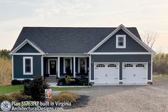 a house with two garages in front of it