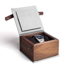 "A simple wooden watch box. The perfect gift for a watch lover. It is ideal for storing a watch that is not used every day. The box will also add a unique character to the watch that someone is about to give. Thanks to this box, the watch will be securely hidden. The box is made of solid mahogany. The bottom and lid of the box are covered with cotton fabric. Inside there is a satin black watch cushion. The box is closed with a natural leather strap. On the inside of the lid, there is room for a Rectangular Watch Accessories With Original Box For Gifting, Rectangular Watch Accessories With Original Box For Gift, Rectangular Watch Accessories In Original Box For Gift, Rectangular Watches With Original Box As Gift, Modern Watch Accessories For Gifts, Personalised Wooden Box, Wooden Watch Box, Watch Lover, Wooden Watch