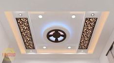 the ceiling is decorated with an intricate design and decorative lights on each side of it