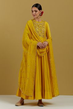 Yellow chanderi silk anarkali with floral hand embroidered yoke. Comes with churidar and chanderi embroidered dupatta.
Components:3
Pattern:Hand Embroidered
Type of Work:Floral Patterns
Neckline:Round
Sleeve Type:Churidar Sleeves
Fabric:Anarkali: Chanderi Silk, Dupatta: Chanderi
Color:Yellow
Other Details:
Loop detailed neckline
Floral embroidered yoke
Striped embroidered dupatta
Occasion:Mehendi and Haldi - Aza Fashions Churidar Sleeves, Yellow Anarkali, Silk Anarkali Suits, Silk Anarkali, Embroidered Anarkali, Set Saree, Saree Gown, Embroidery Neck Designs, Utsav Fashion