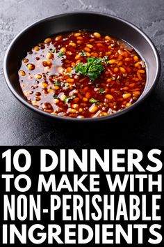 a bowl filled with beans and garnish on top of a black countertop