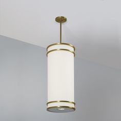 a light fixture hanging from the ceiling in a room with white walls and flooring