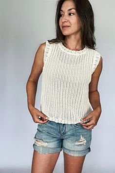 The Tiny Details Ivory Knitted Sleeveless Top White Pointelle Knit Tank Top For Summer, Chic Pointelle Knit Sleeveless Sweater Vest, Chic Pointelle Knit Sweater Vest, White Pointelle Knit Stretch Tank Top, Summer Pointelle Knit Tank Top For Layering, White Stretch Pointelle Knit Tank Top, Summer Textured Knit Tank Top For Layering, Summer Tank Top For Layering In Pointelle Knit, Summer Layering Tank Top With Pointelle Knit