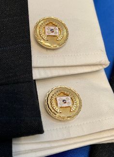 This is a beautiful pair of cufflinks with lots of gorgeous detail. First the gold tone is very bright and shiny. There is diamond cutting around the edge. In the center is a raised wreath of leaves like the olive leaves worn on the heads of ancient Romans. In the very center is a white enamel rectangle with oriental looking designs. What does all this detail mean? We have no idea; we only know that these are good looking cufflinks. Though unsigned, they have been made with quality. We will send Olive Leaves, Eagle Necklace, Dollar Gift, Silver Gift Box, Porcelain Roses, Olive Leaf, Hammered Gold, Ancient Romans, Gold Texture