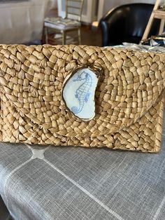 Unique one-of-a-kind oyster shell woven clutch purse. This purse is perfect for your upcoming vacation, cruise, trip to a beach resort or for next summers beachy outfits.  The straw purse has been woven by overseas artisans and finished off with an decoupage oyster that is unique and one-of-a-kind with a nautical touch.   I have many options to choose from if you don't like one of the shell design options that you see send me a message in the note to seller column and I can make the color or style of oyster shell that you would like. Summer Beach Bags With Shell Material, White Straw Clutch Bag For Beach, Handmade Straw Clutch Bag As Gift, Handheld Summer Beach Clutch, White Pouch Clutch For Beach, Handmade Summer Clutch As Gift, White Rectangular Clutch For Vacation, Rectangular White Clutch For Vacation, Handmade Shell Bags For Beach