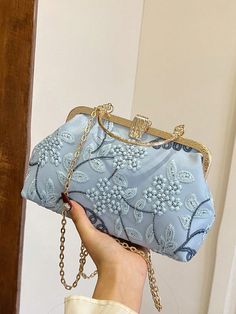 Expertly crafted with delicate blue lace embroidery, this elegant handbag is the perfect accessory for any special occasion. Its sophisticated design and high-quality materials exude a sense of luxury and style. With enough space to hold all your essentials, this handbag is both functional and fashionable. Light Blue Formal Shoulder Bag, Light Blue Rectangular Shoulder Bag For Formal Occasions, Elegant Blue Shoulder Bag Clutch, Light Blue Rectangular Bag For Formal Occasions, Elegant Floral Embroidered Clutch Evening Bag, Floral Embroidered Evening Bags, Elegant Floral Embroidered Evening Bag For Party, Elegant Floral Embroidery Evening Bag For Party, Elegant Party Evening Bag With Floral Embroidery