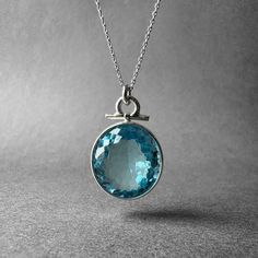 "Pure Clean High Grade Blue Swiss Topaz Ring - Spectacular Big Topaz Pendant - Father's Special Collection Piece - Completely Handmade & Silver Gemstone: Natural White Topaz Metal: Pure and 925 Sterling Silver Stone Cut: Faced Stone Size: 20.9 mm x 19.0 mm - 0.82 in x 0.74 in Pendant Size: 32.6 mm x 20.7 mm - 1.28 in x 0.81 in Stone Weight: 7.7 grams (38.5 carats) Weight: 13.1 grams (65.5 carats) total weight of stone and metal.  For ring orders, ring resizing is free.  Chains are gifts for necklace orders. Note: We don't use any filters for photos. The details may not be clear. Feel free to contact us with any questions, special orders or additional photo or video requests. We will be happy to provide more information! :) WORLDWIDE FedEx, UPS or TNT EXPRESS MAIL SERVICE (Delivery time: 1 Round Light Blue Topaz Necklace, Light Blue Round Blue Topaz Necklace, Blue Topaz Round Pendant Necklace, Round Turquoise Aquamarine Necklace, Blue Faceted Round Pendant Necklaces, Faceted Blue Topaz Blue Necklace, Blue Faceted Round Pendant Necklace, Blue Aquamarine Pendant Necklace, Turquoise Aquamarine Round Necklace