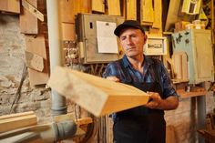 a man is working in a wood shop