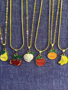 (12,056) Fruit with Positive Words Necklace or Earrings  Gold tone enamel charms Persimmon - >1/2" x <1/2" - Nice Pear - 3/4" x 1/2"  - Lovely Cherries - 3/4" x 5/8" - Smile Peach - <3/4" x <3/4" - Sweet Apple - <3/4" x >1/2" - Happy Orange - 3/4" x <1/2" - Lucky Banana- 3/4" x >1/2" - Money Cute Gold Jewelry With Vintage Charm, Fun Nickel-free Metal Jewelry, Personalized Gold Enamel Charm Necklace, Cute Metal Charm Necklace Nickel Free, Cute Nickel-free Metal Charm Necklace, Cute Nickel-free Metal Charm Necklaces, Retro Enamel Necklaces For Gift, Cute Personalized Enamel Jewelry, Retro Everyday Gold Jewelry