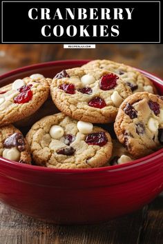 cranberry cookies in a red bowl with white chocolate chips and cherries on top