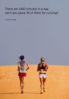 two people running in the sand with a quote