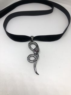 Vintage ornate Snake with Austrian Crystal and silver finish About 2 inch long plus bale All jewelry is shipped in a nice gift box. Check out our over a THOUSAND great reviews Snake-shaped Engraved Jewelry Gift, Engraved Snake-shaped Jewelry Gift, Snake Choker Necklace, Snake Choker, Ribbon Choker Necklace, Ribbon Choker, Choker Pendant, Vintage Gothic, Heart Locket