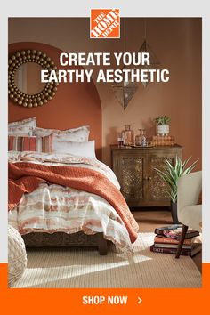 a bedroom with an orange wall and white bedding, gold mirror on the wall