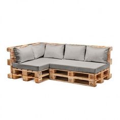 a couch made out of wooden pallets with cushions