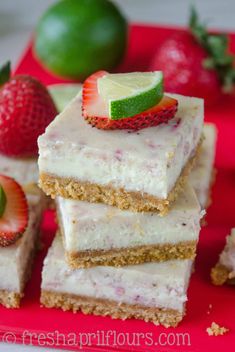 several pieces of cake with strawberries and lime on top