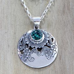 In this ravishing design from Bali's Putu Putri the artisan creates a veritable garden of blooming sunflowers. The flowers are meticulously etched onto a sterling silver pendant that is centered on a sterling cable chain. A cabochon of reconstituted turquoise centers the largest blossom..925 Sterling silver Pendant Designs, Sunflower Jewelry, Metal Clay Jewelry, Silver Jewels, Yoga Jewelry, Flower Pendant Necklace, Cabochon Pendant, Sterling Silver Flowers, Sterling Silver Necklace Pendants