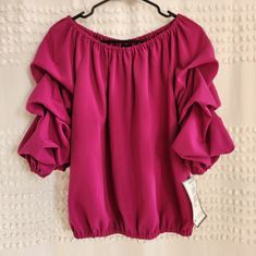 Magenta Pink Rutched And Ruffled Off The Shoulder Top From Macy's, Size Medium Flowy Ruffled Puff Sleeve Top, Flowy Puff Sleeve Top With Ruffles, Stretch Puff Sleeve Blouse With Ruffles, Pink Balloon Sleeve Blouse With Ruffles, Billowy Spring Tops With Ruffles, Billowy Ruffled Top For Spring, Summer Stretch Balloon Sleeve Blouse, Summer Stretch Blouse With Balloon Sleeves, Flowy Balloon Sleeve Blouse With Ruffles