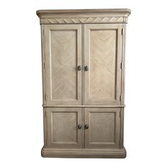 an armoire with two doors and drawers