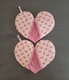 three heart shaped pieces with pink flowers on them