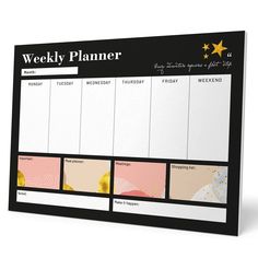 a black and white weekly planner with gold stars on the top, in front of a white background