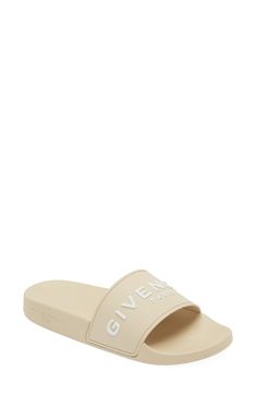 A bold Givenchy logo stamp crosses the wide strap of cushy, water-friendly sliders. Synthetic upper, lining and sole Made in Italy Women's Designer Shoes Summer Open Toe Sandals With Logo Print, Flat Sandals With Logo For Summer, Summer Flat Sandals With Logo, Designer Slides With Branded Insole For Beach, Designer Beach Slides With Branded Insole, Logo Print Slip-on Sandals For Summer, Logo Open Toe Sandals For Summer, Slip-on Sandals With Logo Print For Summer, Luxury Summer Sandals With Logo